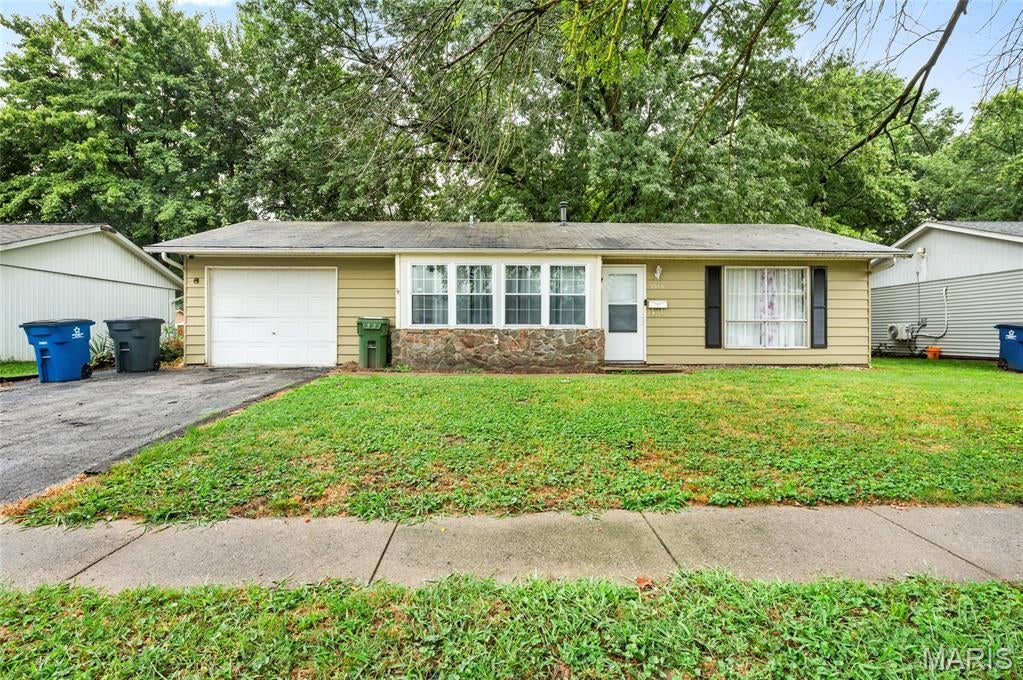 Welcome to 2516 Northbridge Ct. in Granite City, IL! This beautifully updated 3-bedroom, 1-bathroom home is move-in ready with fresh paint and brand-new flooring throughout. Step inside to a bright and inviting living space that leads to a updated kitchen, featuring  newer countertops. The sewer was replaced in 2021, the home also offers a 1-car garage for convenience and extra storage. Outside, you'll find a huge fenced-in backyard, providing plenty of space for pets, gardening, or summer cookouts! Welcome Home!