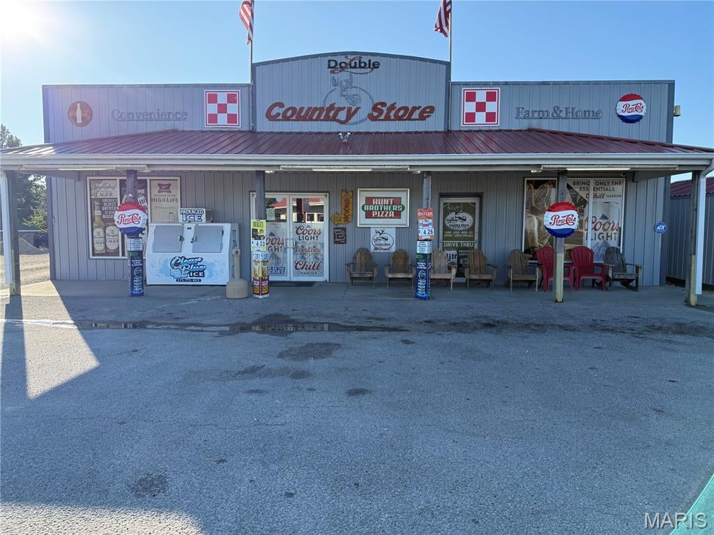 Location! Location!  They say in business location is key, it doesn't get any better than this in Belle MO.  At the junction of Highways 28 & 89 you will find the Double L Country Store that has a little bit for everyone.  Convenience store with a drive up window? This store has one!  Currently selling convenience items such as soda, coffee, beer, alcohol, hunting/fishing supplies, Pizza, deli meat, hotdogs and other numerous grab and go items.  It has a seperate room that currently has a table for locals to gather, or for storytime. Store is being sold turnkey business, with all the current equipment, inventory at closing, land, all buildings and portable carport in use now for housing straw bales.  The store has had several upgrades in the last few years such as, walkin cooler, alarm system, restroom, new stainless steel cabinet and table for pizza making, new cooler/freezer for pizza supplies.  Possibilities are endless with this great location. More pictures to follow.