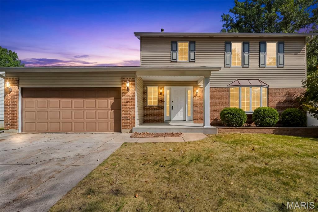 OPEN SUNDAY, 1-3pm Welcome home to this spacious two-story in desirable Riverwood Trails, Hazelwood! This 3 bed, 2.5 bath home offers 2,048 sq ft of comfortable living space. Enjoy fresh paint throughout the main level, updated bathrooms with tall toilets & vanities, and new light fixtures. The beautiful bay window with copper canopy adds charm both inside the front room and from the curb. Spacious kitchen with peninsula opens to family room with cozy wood-burning fireplace. The primary bedroom features a walk-in closet and additional linen closet, while the other 2 bedrooms feature closets that span wall-to-wall. Unfinished basement offers laundry hookups for up to 2 washers and 2 gas dryers! Plus tons of storage or future finishing potential. Major systems are covered: architectural roof and 6" gutters/downspouts (2013), Trane HVAC (2016), and a brand-new 18' x 30' backyard patio (2021)—perfect for entertaining! Zoned for Hazelwood West/Russell Elementary. Neighborhood offers mature tree-lined streets and park with playground, tennis & basketball courts, along with everything the City of Hazelwood has to offer.
