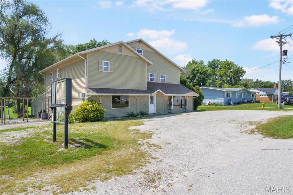 Discover a unique opportunity in Edina, Missouri! This property spans approximately 2 acres M/L and features a spacious 3-bedroom, 2-bathroom home above a 2,000 sq ft commercial office space on State Highway 6.  With no zoning or code restrictions, the possibilities for growth are endless!  The home boasts an open layout filled with natural light, ideal for hunting lodge, family living or short term rental. The adjoining retail space offers ample storage and flexibility for various business ventures.  With plenty of room to expand, this property merges residential comfort with commercial potential. Don’t miss your chance to explore this unique property. https://raven-media-group.aryeo.com/sites/bexqkke/unbranded
