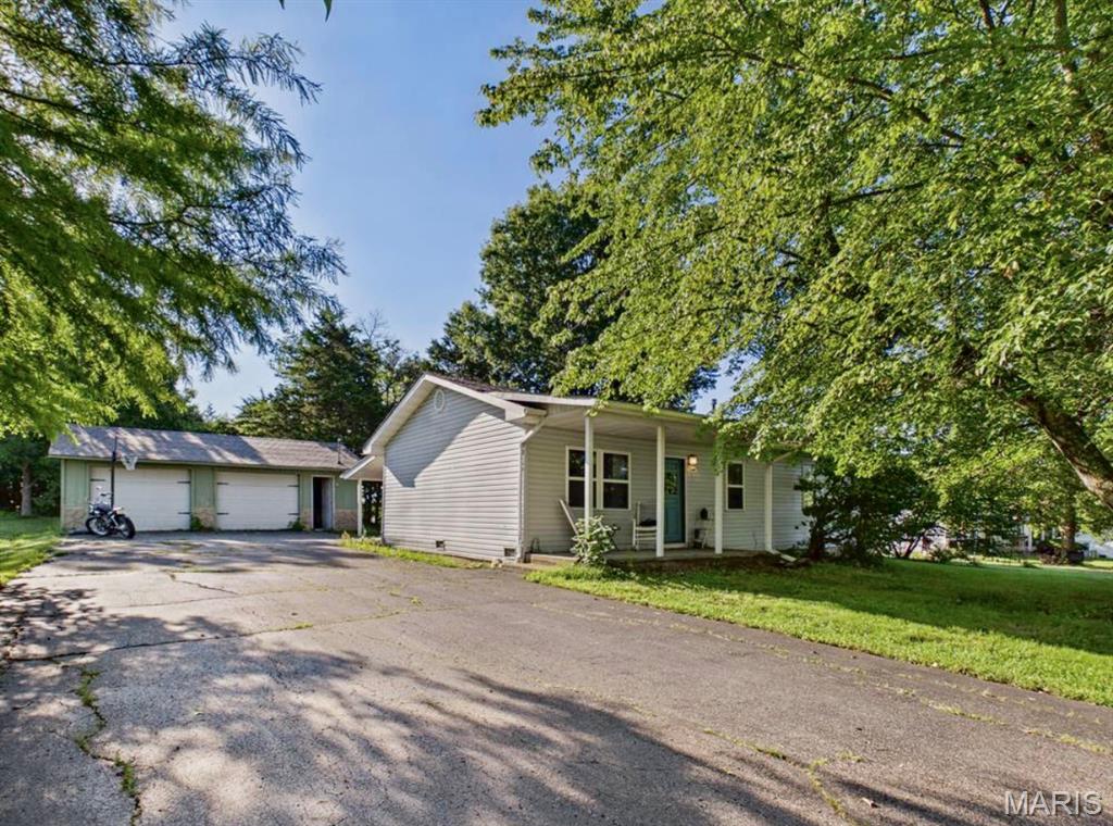 Charming 3-bedroom, 2-bath home offering comfortable living, thoughtful updates, and a welcoming vibe from the moment you pull up. Recent improvements include a refreshed kitchen and a new water heater, while low-maintenance vinyl flooring throughout simplifies everyday life. Outside, the shaded .32-acre yard provides a serene backdrop with mature trees and ample room to relax and unwind on a quiet evening. Just a short walk to Crocker Community Park, this home blends small-town warmth with daily convenience.

The spacious detached 2-car garage includes concrete floors, electric, and a dedicated office area—ideal for a workshop, hobby space, home business, or extra storage. Whether you’re purchasing your first home or seeking to downsize, this property delivers comfort, versatility, and room to make it your own.