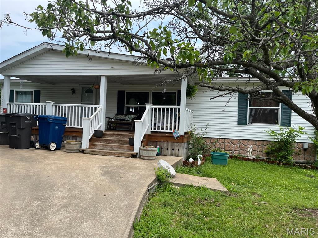Discover a unique opportunity at 1671 Drake Ln, RBRTSVLL MO 63072, a single-family residence built in 1988 that embodies comfortable living in RBRTSVLL. There are 3 bedrooms, 2 bathrooms, kitchen, Living Room, laundry room, and Sunroom. The Primary bedroom has a bathroom suite. Outside is a large barn and has an outbuilding.  This property offers a chance to create a personal sanctuary, reflecting a blend of classic design and potential for modern updates. The three bedrooms provide versatile spaces for rest and personal retreat, each offering a foundation for individual style and comfort. With two bathrooms, the home accommodates daily routines with practical ease. An inviting porch extends the living space outdoors, offering a charming spot for relaxation and enjoyment of the surroundings. This RBRTSVLL residence has a pond and presents an exceptional opportunity to embrace a lifestyle of ease and personalization. Seller is selling as is and in as is condition. Others have helped themselves to this home and have taken some wiring and plumbing. All measurements and info needs to be verified by the buyer's.