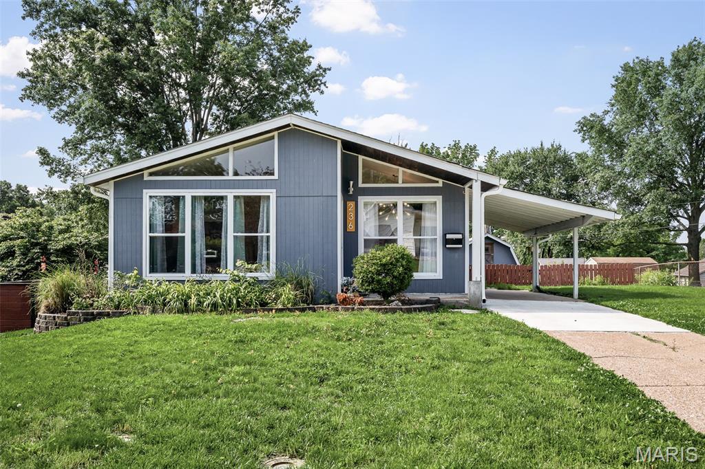 Back on market - no fault of seller. An Uncommon Level of Craft, Detail, and Design, rarely does a property command attention at every turn — this one does. On approach, the custom wood soffit and tongue-and-groove porch signal the level of intention that defines this home throughout. Every upgrade, every material choice, every finish reflects a commitment to enduring quality over fleeting trend. Structural investments speak for themselves: newer siding, roof, gutters, thermal windows, and AC form a comprehensive envelope of efficiency and protection — complemented by a 200 AMP electrical upgrade and the rare distinction of a Solar Trom Wall, whose seasonal sail harnesses winter sun and casts summer shade with elegant precision. Inside, the kitchen and bathrooms read as curated collections rather than mere renovations — artist-crafted elements, reclaimed and live-edge wood vanities, custom flooring, and dual showerhead showers woven together with floors of rich hardwood, Travertine, and marble tile. Designer lighting adds warmth and dimension throughout. The walk-out lower level unfolds into its own sanctuary — a private primary ensuite, a quiet home office, an expansive family room, and a laundry suite that redefines the word utility. Every square foot has been thoughtfully considered. Step outside to grounds that extend the home's sense of care: perennial flower beds cascade along retaining walls, a rear walk-out patio opens to a sweeping lawn, and a bespoke 12×12 shed — with 8-foot ceiling, a finished loft, and private balcony — stands as a property unto itself awaiting your personal final use decision.