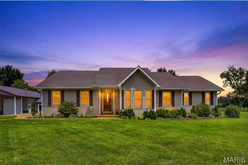 IF YOUR LOOKING FOR A HOME IN THE COUNTRY THAT SIMPLY HAS EVERYTHING, YOU'VE FOUND IT RIGHT HERE AT 1957 SCHNARRE ROAD IN FORISTELL.  NO HOA~ UNINCORPORATED.  YOU CAN WORK NEXT DOOR IN YOUR 36X54 CLIMATE CONTROLED OUTBUILDING THAT HAS IT'S OWN 16X27 OFFICE WITH A BATHROOM, 36X9 LOFT AND A 17X54 LEAN TO.  THE DOORS IN FRONT ARE EACH 12X9.9-   AT THE END OF A HARD DAYS WORK COME HOME... STEP INTO YOUR PRIVATE HOT TUB OR RELAX ON THE BEAUTIFUL COVERED DECK THAT OVERLOOKS YOUR TRANQUIL- PRIVATE YARD AND POND.  KITCHEN HAS UPGRADED MAPLE CABINETS~CENTER ISLAND~STAINLESS APPLIANCES~GRANITE COUNTERTOPS~WALK IN PANTRY.  HOME ALSO HAS ANDERSON WINDOWS THROUGHOUT.  THE LOWER LEVEL HAS A REC ROOM AND TWO ADDITIONAL ROOMS THAT EACH HAVE WALK IN CLOSETS ALONG WITH A FULL BATHROOM~9' CEILINGS~WALK OUT TO THE 23X17 AGGREGATE PATIO.  A MUST SEE!!!  SO MANY DETAILS THAT YOU NEED TO SEE, LIKE THE STONE SIDEWALK LEADING TO YOUR BUSINESS AND REAR YARD...TRULY UNIQUE~WE ALL NEED A HOME WITH A LIFESTYLE, THAT CALMS YOUR SOUL...1957 SCHNARRE ROAD DOES THAT!  YOU CAN BUILD ON THE AJACENT FOUR ACRES WITH POND OR SELL IT.  IT'S INCLUDED IN THIS PURCHASE, TAX ID 4-0041-S008-00-0006.3000000 SKY IS THE LIMIT.    CALL LISTING AGENT TODAY FOR A SHOWING