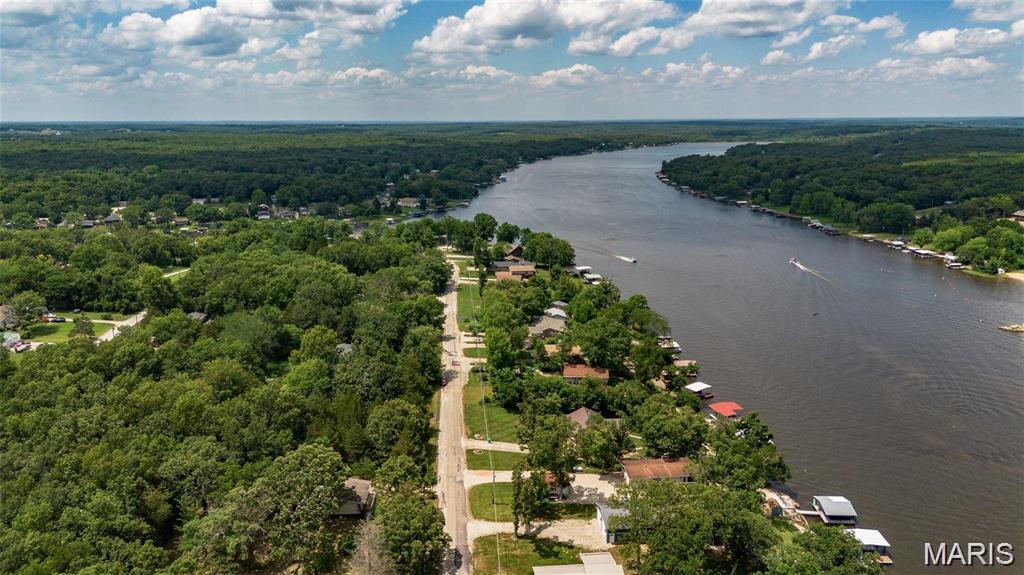 Discover an exceptional opportunity in the Indian Hills Subdivision with this unique sale, offering two lots for the price of one! This purchase includes lots 928 and 929, combining for approximately 0.48 acres of real estate. Situated along the main road, these lots provide a stunning view of the 326-acre community lake, making them an ideal spot for building your dream home, or simply gaining access to the lake. Don't miss out on this rare chance—schedule your appointment today to explore the potential of these beautiful lots!