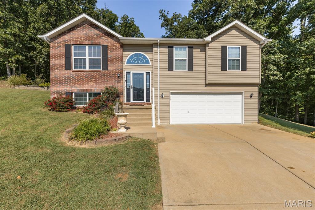 Spacious Split-Level Home on a Cul-de-Sac! 

Welcome home to this inviting 4-bedroom, 3-full-bath split level located in the nice West Ridge subdivision and just a short walk to Festus West City Park & schools. This home offers a fantastic layout with an open-concept kitchen, dining, and living area—perfect for entertaining, family gatherings, or everyday living. The main level features 3 bedrooms and 2 full baths, while the lower level provides incredible flexibility with potential for the 4th bedroom or private in-law quarters, complete with its own full bath and laundry area. Step outside to enjoy the 21’ x 12’ concrete patio just off the kitchen, overlooking the pie-shaped lot that backs to the woods for added privacy. The oversized attached 21 x 30’ garage provides plenty of room for vehicles, storage, hobbies, or recreational toys. Recent updates include a NEW ROOF in 2024, and the seller is offering a $2,500 carpet/flooring allowance with an acceptable offer. This home offers space, privacy, location, and value all in one! Easy to show, and the seller is ready to see your offer. Come take a look and make this one yours!