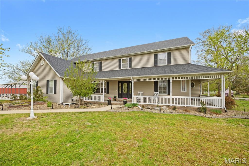 Discover the privacy, space, and lifestyle you've been looking for on 8.3 beautiful acres, featuring a stunning 1.25 acre pond, fenced orchard, chicken coop, gazebo with swing, above-ground pool, and a versatile paddock/ dry lot with shelter space and outdoor riding arena for horses or other livestock. Whether you're looking for room to enjoy the outdoors, hobby farming, animals, recreation, or simply a peaceful private setting, this property offers an exceptional opportunity.

Nestled among the acreage is a beautiful custom-built 3-bedroom, 4-bath home with inviting curb appeal and a wraparound porch. The main level features soaring cathedral ceilings, a gas fireplace with brick hearth, spacious primary suite, and a recently renovated primary bath complete with double vanity, soaker tub, and separate shower. The eat-in kitchen offers charming shiplap detail and views of the property. A convenient main-level laundry, formal dining room, two half baths, and bonus room provide plenty of flexible living space. Upstairs you'll find two generous sized bedrooms, a full bath, and a spacious recreation room, offering room for family, guests, hobbies, or a home office.

Additional features include a 4-foot crawl space for easy access, a split heating and cooling system, and a brand-new heat pump in 2026 for the main level. The home also boasts a fully paid-for, ground-mounted solar panel system installed in December 2025, providing exceptional energy savings and long-term value. New roof in 2025 adds even more peace of mind.

Enjoy a rare combination of acreage, water, outdoor amenities, energy efficiency, and a beautiful custom home.