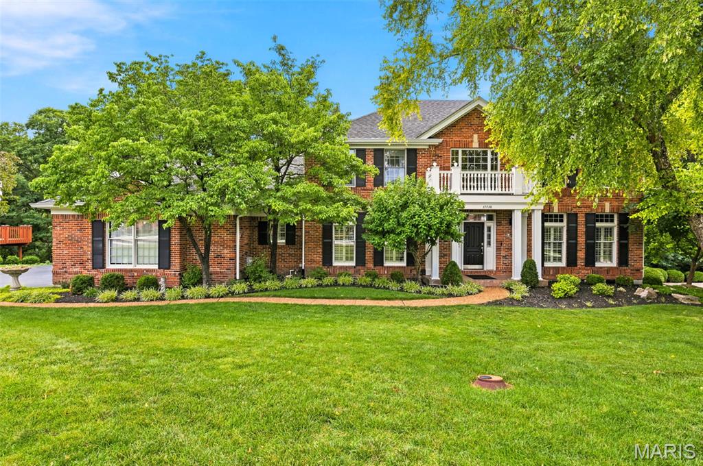 Stunning 4+ Bedroom Wildwood home on a private half-acre lot in the highly desirable Wildhorse neighborhood with a beautiful backyard, served by top-rated Rockwood Schools. This bright, open-concept floor plan features a main-floor office with 9-foot ceilings, crown molding, and plantation shutters, seamlessly flowing into a spacious family room with a wood-burning fireplace, built-in shelving, and floor-to-ceiling windows. The gourmet chef’s kitchen is fully upgraded with an oversized quartz center island with an ogee edge, custom Woodland cabinetry, stainless steel Jenn-Air appliances, a coffee bar, butler's pantry, and a sunroom offering panoramic treetop views. A modern sliding barn door reveals a convenient main-floor laundry room. The upper level boasts a luxury primary suite with a coffered ceiling, two walk-in closets, dual vanities, a soaking tub, and a separate shower, alongside three spacious secondary bedrooms and a second full bath with dual sinks. The fully finished walk-out lower level adds over 1,200 square feet of premium living space, complete with a granite wet bar and island, custom cabinetry, two mini-fridges, a full bath, and an office/optional sleeping room. Step outside to a private concrete patio or the extended upper deck, both featuring a new roof overhead (2 years old). The home backs to 20 acres of private, wooded grounds and offers a cleared area that serves as a beautiful, secluded backyard for outdoor activities. Includes a 3-car side-entry garage. Premium Wildhorse subdivision amenities feature two neighborhood pools, tennis and basketball courts, scenic lakes, and walking trails, all with quick proximity to Chesterfield Valley shopping and dining.  Private showings begin Friday June 19 with Open House Saturday June 20 from 12PM- 2PM