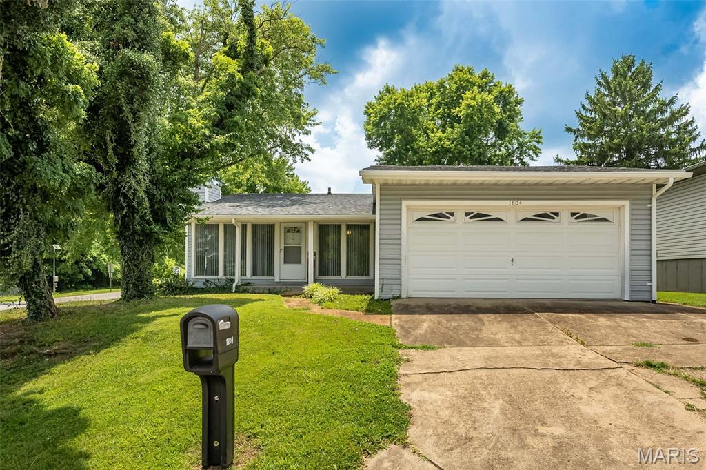 Looking for a ranch with room to spread out? Welcome to 1804 Fairfax Drive! Filled with natural light, this spacious 3 bedroom, 3 bath home offers a great layout, several recent updates, and plenty of opportunity to make it your own. You'll love the newer LVP flooring throughout much of the main level, along with two updated bathrooms on the main floor. The spacious family room features a wall of windows and a cozy fireplace, while the separate dining area offers plenty of space for family dinners, holiday gatherings, and entertaining. Just off the dining area, the eat-in kitchen offers stainless steel appliances, space for a breakfast table, and sliding glass door leading to the back patio. The oversized 24' x 12' primary suite is a true highlight, offering plenty of space to unwind, along with its own private updated bathroom, two closets, and newer sliding glass door leading to the back patio. The second bedroom also features a newer sliding glass door, creating easy access to the backyard. Need a little more space? The lower level is already framed out with drywall and a ceiling, making it easy to add your own finishing touches and create even more living space. Outside, you'll appreciate the spacious corner lot, attached 2-car garage, and a new roof installed in 2024. And the location is hard to beat! Sitting directly across from one of the neighborhood common grounds, pavilion, playground, and additional guest parking means you'll have extra space to enjoy without having to maintain it. If you've been looking for a home with generous room sizes, a functional layout, recent updates, and the opportunity to build equity while adding your own personal style, this is one you won't want to miss!