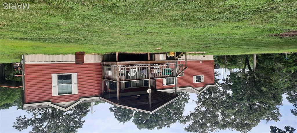 HELLO HAPPY HOUSE, smiling on 6.60 mostly level Acres, overlooking a beautiful Sparkly private Lake, sitting back enough from the Highway to enjoy a BBQ or a Movie inside, hosting a stunning home with 3 big bedrooms, full ensuite offers soaking tub, shower and walk-in closet plus all the space you can dream you need, large guests bedrooms flank the complete other side of the home offering privacy for all and share a full bathroom with guest in the living room.  See this kitchen? Oh yeah, this kitchen has it all - beautiful cabinetry, stunning appointments, raised Breakfast bar, open to the dining room for easy services and personal connection with the chef as you discuss your day.  This Living Room is the heart of a home, ready for a large crowd or a small gathering.  An RV type metal carport and shome sheds really bring this beauty alive  Move in Condition this home is ripe for your picking.