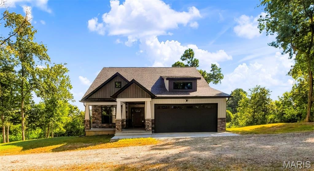 Professional pictures coming soon

Set on 5 peaceful acres with breathtaking views and a park-like setting, this beautifully built new construction home offers space, quality, and thoughtful details throughout. Featuring 5 bedrooms, 3 baths, 2x6 exterior walls with Rockwool insulation, Andersen windows, and bamboo flooring on the main level, this home was built with comfort and longevity in mind.

The main living area is open and inviting with vaulted ceilings in the kitchen and living room, quartz countertops, under-cabinet lighting, and a gas fireplace that anchors the space. The primary suite is a true retreat with a tray ceiling, walk-in closet, private access to the covered composite deck, and a spacious bath with soaking tub and separate walk-in shower.

The covered 16x16 composite back deck extends the living space outdoors and steps down to the patio below, where the walk-out basement opens to the surrounding acreage and views.

Downstairs, the finished lower level features a 9' basement pour, additional living space, an extra room perfect for a home office, plumbing for a future wet bar, and setup for a wood-burning stove. The walk-out design provides easy access to the patio and backyard.

Practical features were not overlooked, including an oversized finished 2-car garage, generous walk-in closets, and a dog-washing station in the mud/laundry room. Outside, a level pad has already been prepared and piers poured for a future 40x40 pole barn.

If you're looking for a quality-built new home with acreage, privacy, beautiful views, room to spread out, this one will not disappoint.