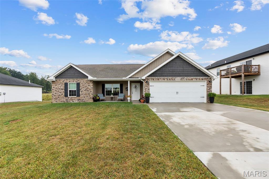 Built in 2023, this beautifully customized 3 bedroom, 2 bathroom home offers all the benefits of newer construction with thoughtful upgrades that set it apart from the rest.
Inside, you'll find LVT flooring throughout and a desirable split bedroom floor plan. The sellers have added character and functionality with wainscoting, a stone fireplace, custom closet systems, and other details that give the home a more finished, custom feel. Even the garage has been upgraded with a workbench and organized tool storage.

The outdoor space is a true highlight. A gazebo, firepit, and stone pathway create an inviting backyard retreat that's ready for relaxing, entertaining, and evenings outside. A separate storage shed provides even more space for lawn equipment and outdoor gear.

Move in ready, beautifully maintained, and filled with upgrades inside and out, this home offers the ease of newer construction with the personality and finishing touches already done for you.