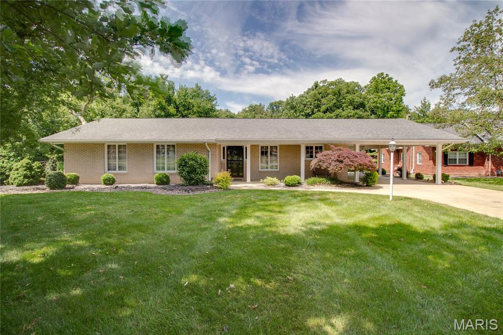 Beautiful, all brick home in a great location in the heart of Jerseyville. This home features a covered front porch with a welcoming front entry foyer that leads to the family room and into the amazing all season sunroom. The galley style kitchen is super efficient with plenty of cabinet space and a breakfast nook. This home has 3 bedrooms on the main floor with a primary suite and private en suite bathroom. There is a formal dining room that is right off of the kitchen. The home has an enormous living area and recreation room in the finished basement with a combo laundry and 3/4 bathroom. Lots of storage space in the basement as well and a walk out to the patio in the backyard. The covered parking area is an added bonus for grilling under roof and out of the weather. This home has some beautiful features and a large yard with some mature trees. So don't miss a chance to take a look at this gorgeous home in a great neighborhood!