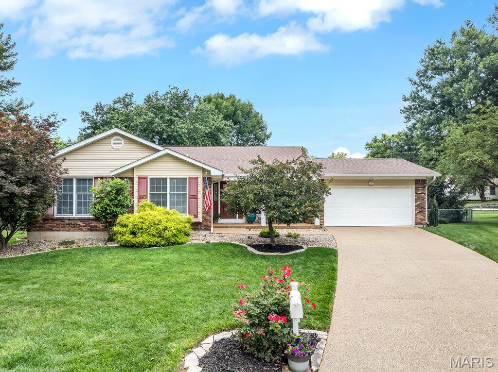 Located on a quiet cul-de-sac with a .42 acre level, fenced yard, mature trees, this updated Great Room Ranch features a rare FOUR Bedrooms on the Main level.  With 3000+ sq ft of total living space which includes the professionally finished basement, there's a place for everyone and great entertaining opportunities year round. Engineered Wood floors with 4" baseboards span the main level and Ceramic tile in 2 bathrooms.  Features include Anderson oversize double hung windows, Atrium door to patio, Bay window seat in Kitchen, white panel doors with bronze lever handles, skylights, vaulted ceiling, fan, wood burning FP, Crown molding in Dining Rm and Foyer. Kitchen has lots of natural light, white cabinets, quartz countertops, large single granite sink, stainless appliances and refrigerator which is ncluded in sale. Take the Hardwood stairs down to a versatile Family Room with luxury vinyl plank floors, open floor plan, built-in entertainment center, seating area, rec and play areas all well-lit with dimmable LED lighting. There is a Flex/Bonus room/sleeping area, the 3rd full bath, and storage galore. Unfinished space has workshop, more storage and 50 gal water heater. An inviting and private back yard awaits with gazebo on one patio adjoining a 25 x 19 ft 2nd patio with privacy fence. A sun deck, 27 ft round pool, garden and shed, plus more yard space make this a "lets stay home" kind of place. Architectural roof, oversize downspouts, Archway pebble stone professional finished driveway, covered front porch and landscaping offer great curb appeal. Subdivision has 3 fishing lakes and low HOA fee. Easy access to 364/94, stores, dining and several parks.  AAA rated Francis Howell Schools. Home has been well maintained yet Seller offers a 1 year Choice Ultimate Warranty (includes pool) for Buyer's peace of mind.  Refrigerator, Pool table, wall mounted TVs will stay. Schedule your private showing by contacting your Buyer's Agent today.