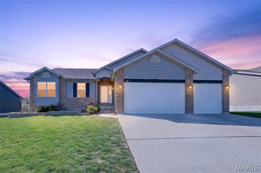 BETTER THAN NEW! Why wait to complete projects after closing when this move-in-ready home already offers extensive upgrades, mature landscaping, outdoor living spaces, and a rare oversized 3-car garage with approximately 4 feet of additional depth, insulated 8-foot doors, finished interior, and additional electrical service? Located in an established neighborhood with NO NID assessment, this beautifully maintained walkout ranch sits on a quiet dead-end street backing to open ground.
Offering approximately 1,610 sq. ft., this 3-bedroom, 2-bath home features a thoughtfully designed open floor plan highlighted by a vaulted great room and stunning floor-to-ceiling stone wood-burning fireplace. The kitchen is designed for both everyday living and entertaining with granite countertops, tile backsplash, staggered cabinetry with crown molding, center island, pantry, stainless steel appliances, and additional custom cabinetry. The dining area walks out to a large wrap-around deck with covered awning, creating the perfect space for morning coffee, outdoor dining, or simply relaxing while enjoying the private backyard setting.
The spacious primary suite offers a custom walk-in closet system and private bath with double vanity and shower. Additional features include fresh interior paint, water softener, whole-house humidifier, custom closet organizers, raised garden beds, underground drainage system, hidden storage beneath the deck, and a woodshed with approximately 5-cord capacity.
The full walkout basement features French doors, a lookout window, rough-in bath, abundant storage, and endless possibilities for future living space, recreation areas, home office, or additional bedrooms.
Unlike many newer homes, this property already offers completed landscaping, expansive outdoor living areas, premium upgrades, and exceptional garage space. With a floor-to-ceiling stone fireplace, oversized garage, wrap-around covered deck, walkout basement, and numerous improvements already in place, this home delivers outstanding value and is truly move-in ready.