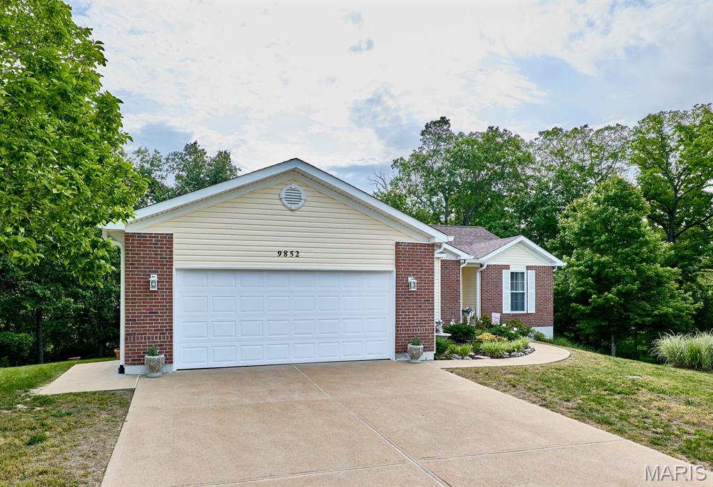 Fantastic 3 bedroom, 3 bathroom ranch home located at the end of a cul-de-sac. This split bedroom home is loaded with upgrades. From the beautiful hardwood flooring to the vaulted great room to a separate dining room to the large master bedroom suite to a main floor laundry, this home offers a lot to love. Additional features include a wonderful covered deck, 2 car garage, finished walkout lower level, newer roof and gutters, home backing to trees for privacy and so much more.