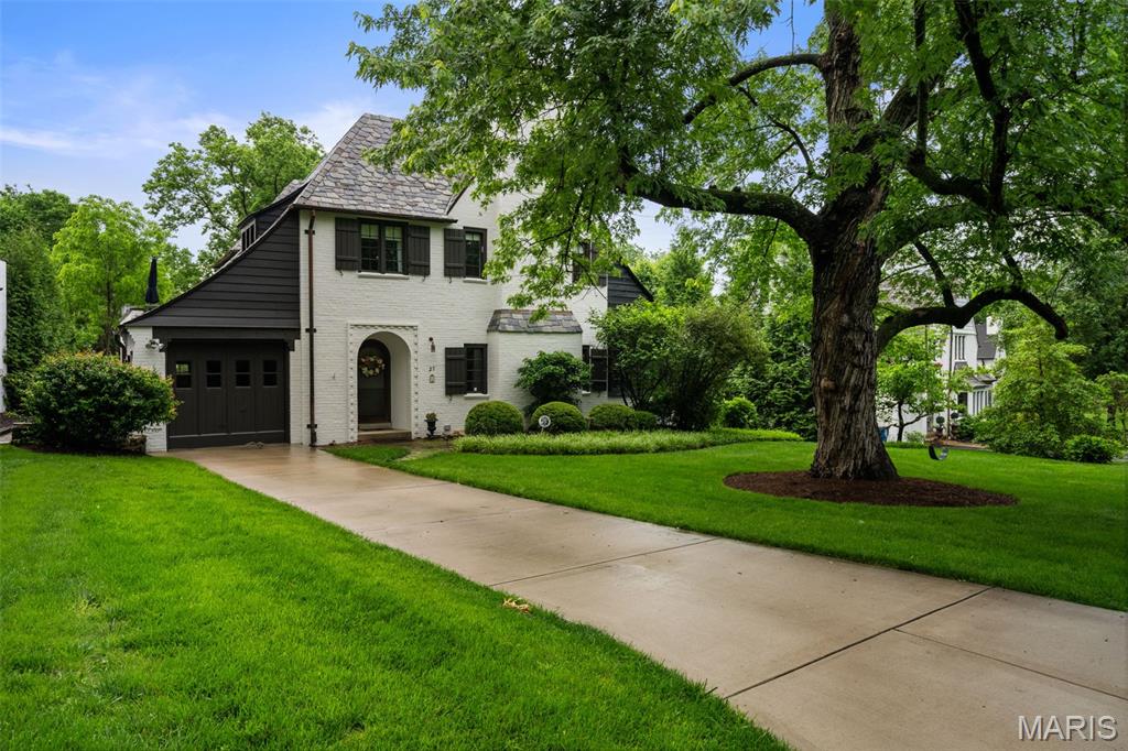 Storybook cottage located on the sought-after Ridgetop Drive.  Charming, charming, charming...graceful entry foyer opens to very spacious, beamed-ceiling living room with stately fireplace with 3 seating areas.  Light-filled sunroom off formal living room welcomes you, ideal for a home office/study, family room or just for relaxing.  Formal dining room with French doors overlooking lush backyard, original butler's pantry is great additional storage, updated kitchen with light-colored, cherry cabinets PLUS 1st floor powder room.  Half way up the stairs is a cozy, rooftop deck perfect for enjoying the sunshine or a quiet corner to just read a book and/or lounge.  Upstairs features a very spacious primary bedroom, 2 additional bedrooms & 2 full baths.  Charming brick terrace off the rear of the home.  This one won't last!   Pictures will be up on Monday, July 6, 2026.