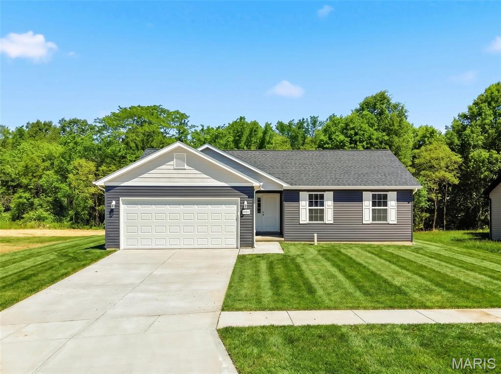 USDA No Money Down Territory! Inventory Home- Move in Ready! Sitting on a quiet level lot that backs to Trees The Bluffwood A Model Boasts 3Bed/2Bath Open Floor plan. Enter in the Foyer to the Great Room with Vaulted Ceilings W/Ceiling Fan. In the Kitchen you will find 42in White Shaker Cabinets, Granite Counters, Pantry, Stainless Steel Appliances and Recessed Lighting. The Master Suite includes a Walk-In Closet, Ceiling Fan, and an en-suite bathroom with a linen closet & a Step-In Shower. Other Interior Upgrades include Upgraded Flooring, Tilt-in Windows, 2 Panel Doors with Brushed Nickel Hardware and Brushed Nickel Light Fixtures. Full Basement W/ Egress Window, Sump-Pump, and Rough-In Bath. The Exterior includes full 2 Car Garage, Architectural Shingles, Maintenance-Free Vinyl Siding, Shake Siding in the Gables, Sodded Front yard & a Patio Included. Schedule your showing today!
