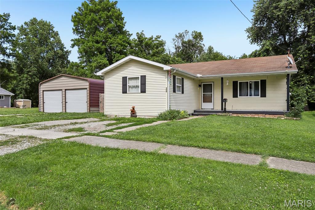 More Space, More Possibilities, More to Love! Welcome home to this inviting 3-bedroom, 2-bath property offering the flexibility today's buyers are looking for. In addition to the three bedrooms, a spacious bonus room provides the perfect opportunity for a fourth bedroom, home office, playroom, or hobby space. The heart of the home features an open-concept living room and kitchen, creating a bright and welcoming atmosphere that's ideal for both everyday living and entertaining. The primary bedroom includes its own private en suite full bath, offering a comfortable retreat at the end of the day. Step outside to enjoy the covered back deck, perfect for morning coffee, outdoor dining, or relaxing while overlooking the large backyard with plenty of room for pets, play, gardening, or gatherings. A detached two-car garage provides ample parking and additional storage space. Don't miss the opportunity to make this versatile and well-designed home your own!