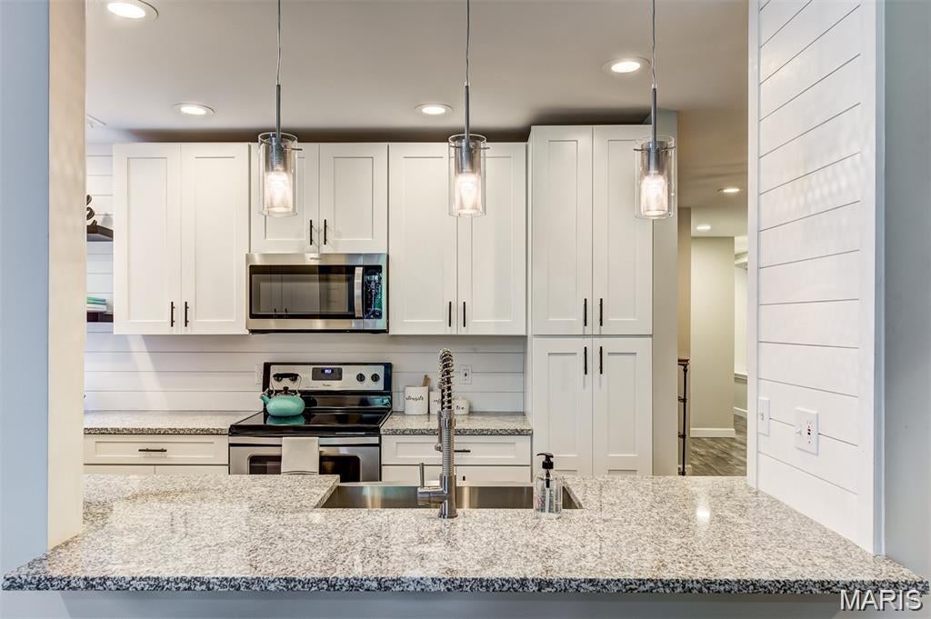 STUNNING UNIT! Live in the Heart of the Central West End! Gated parking lot with garage space!  Just steps from neighborhood restaurants, the Cathedral, and Cortex, this spacious and beautifully updated 2-bedroom, 2-bath condo is ready to move in! The open-concept kitchen features new white shaker cabinetry, granite countertops, and stainless steel appliances, creating a bright and inviting space for cooking and entertaining. Wide-plank, barn wood–style flooring adds warmth and character throughout, while the kitchen opens seamlessly into a light-filled living room complete with  wood-burning fireplace. Both bedrooms are generously sized and feature large walk-in closets and  updated full baths, offering the comfort and privacy of two primary suites. Additional highlights include a custom built-in bookcase and charming office nook, perfect for working from home or creating a dedicated reading space. A garage parking space in a secure lot is included—a rare and valuable amenity in the Central West End. The home also features a large laundry room with washer and dryer hookups. For outdoor enjoyment, two separate deck areas provide plenty of space to grill, relax, entertain, or unwind on warm summer evenings. Don't miss this rare opportunity to lease a home that combines original character, thoughtful updates, and an unbeatable Central West End location!