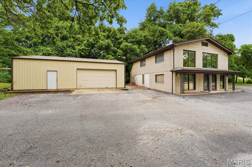 MOTIVATED SELLER! Excellent commercial opportunity with high visibility on a busy street.  This property is currently zoned commercial SR3, and the commercial potential and possibilities are endless.  This property was once used to manufacture dentures, but the current layout and setup is great for multiple offices, work live area, retail, car repair, or your own private entertainment space.  The pole barn/garage is well insulated with house wrap and spray foam insulation.  The garage has a concrete floor, heat, 200amp breaker box, and all storage cabinets stay.  The roof on the main building was installed October 2023.  The gutters and gutter guards on the main building and garage were installed approximately 6-7 years ago.  Air conditioning units in the main building do not work but the furnaces do.  This property sits in St Clair County not the city of Belleville.  The property is being sold as is so bring your ideas and imagination and come take a look.    All information to be verified by buyer and buyer's agent.
