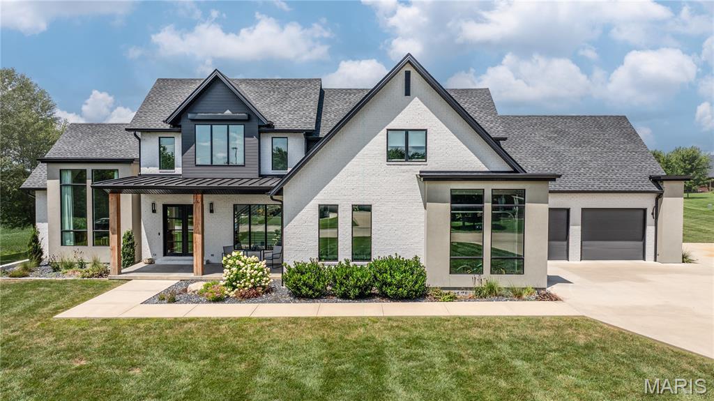 Welcome to one of Jackson’s most exceptional homes—a true showstopper that blends luxury, comfort and privacy. Built in 2022 and offering over 6,000 finished square feet, this stunning custom home is tucked away on a peaceful 2.1-acre lot at the end of a dead-end street, providing the perfect private retreat. Designed with everyday living and entertaining in mind, the open-concept floor plan is filled with amazing natural light and showcases high-end finishes throughout. The striking double-sided gas fireplace creates a warm focal point between the main living spaces, while the chef’s kitchen and spacious gathering areas flow effortlessly to the outdoor oasis. Step outside to your own resort-style backyard featuring a huge in-ground pool, expansive covered patio, and plenty of space to relax or entertain while enjoying the privacy of the surrounding property.
This impressive home offers five spacious bedrooms, four full bathrooms, and two half baths, ensuring room for you and your guests. The primary suite creates a retreat with an additional quiet room, top of the line bath and a massive walk in closet complete with custom organziers. The oversized three-car garage provides abundant storage for vehicles, recreational equipment and more. The lower level boasts another expansive family room and a heated and cooled room with a glass garage door, perfect for a workout room or a private office.  Every detail of this home has been thoughtfully designed for style, convenience, and quality. Don't miss out on the opportunity to make this house your home!