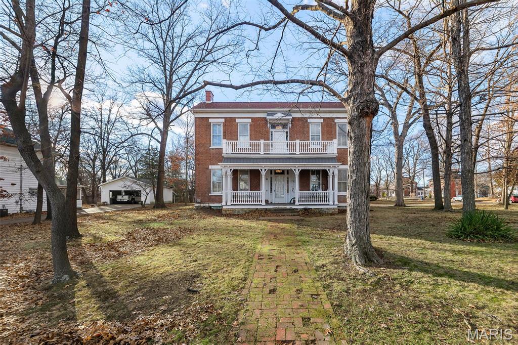 A truly rare offering, this distinguished Victorian home—listed on the National Register of Historic Places—is located in Sparta’s legendary Bricktown District and rests on over an acre of in-town grounds, an exceptional feature for a property of this era. Originally built in 1865 with a thoughtfully designed addition completed in 1890, the residence showcases 12 solid brick walls and soaring 12-foot ceilings, reflecting a level of craftsmanship and architectural integrity rarely found today.
The home has been meticulously and intentionally renovated with a focus on preservation, longevity, and high-end modern luxury, seamlessly blending historic character with today’s most refined comforts. Every update was carefully curated to honor the home’s original integrity while elevating it to contemporary luxury standards, resulting in a timeless yet truly move-in-ready residence.
Interior highlights include original millwork, a grand primary bedroom, generously sized additional bedrooms, and a sun-filled second-floor solarium.  Bathrooms exude classic elegance, featuring a claw foot tub complemented by upscale modern finishes, while a conveniently located second-floor laundry enhances everyday living. The remodeled kitchen is a statement of modern luxury, offering quartz countertops, new premium appliances, and top-tier finishes throughout.
Major improvements include two new energy-efficient HVAC systems with new ductwork (2025), fully updated electrical, all new drywall, new flooring, fresh interior paint, all new fixtures, kitchen remodel, master bathroom and upstairs bathroom remodel, blown-in cellulose insulation, and professional tuck pointing—ensuring both comfort and long-term durability. Seller has also had extensive work done by a professional arborist. Roof is four year old.
Additional value is found in the impressive 32' x 28' two-car garage with a full loft above, offering exceptional flexibility for a guest suite, home office, studio, or potential mother-in-law accommodations.
This is a rare opportunity to own a historically significant Victorian residence enhanced by luxury-level modern updates, expansive in-town grounds, and a premier location within one of Sparta’s most iconic districts.Average electric is very efficient at $300.00 monthly