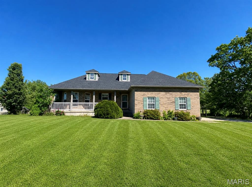 Country Living in Waynesville, Close to Ft. Leonard Wood along with a Paved Road all the way to your Driveway! No Dirt roads to have to deal with! This Beautiful Home on Rose Meadow Ln. is a 3 Bedroom with a Den large enough to make it a 4th Bedroom. It has 2.5 Bathrooms. This entire Neighborhood is one of the Great ones! The Brick Homes on Rose Meadow Ln. all have Large Flat yards, they are all Top-Quality Construction with privacy in mind, serene country views of a Pond out back and enjoy the Horses grazing the Pasture across the street! Upon entering the home you will notice the Charming covered Front Porch, then you will walk in and see Cathedral Ceilings, Large Space in every room, a Kitchen with abundant Counter space, partially open to the Dining Room & Living Room (perfect for Entertaining). The Over-sized Master Suite, main floor Laundry, Office (Nursery/Play-Room/or Craft-Room) all on the Main- Level with a walk out Balcony that overlooks the fenced back yard & Pool! Downstairs has a Walk-Out Basement where you will find a Large Family Room, 2 more Bedrooms with Abundant Closet/Storage space throughout, along with a full Bathroom. There is an above ground pool out back, and a Large 2 story Metal Pole Barn/Workshop providing additional enclosed parking. You will not want to miss this Gem, they don't make them like this anymore! This home has a Gorgeous, Brand new roof with a Warranty. This home is also coming with a flooring credit, allowing you to pick out the brand new flooring type and color of your choice!