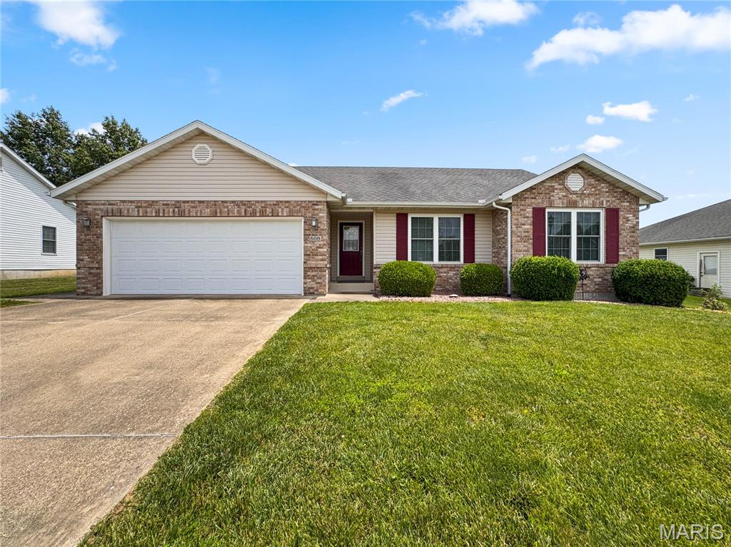 Beautifully maintained ranch with over 2,000 finished square feet and a full finished basement, offering great curb appeal, an ideal location, and a special surprise out back. From the moment you arrive, the pristine condition of this home is unmistakable. It has been lovingly cared for and is truly ready for its next chapter.

Step into the light-filled formal foyer and enjoy the open-concept layout. Just off the entry is a flexible bonus/dining room that can serve as a home office, music room, playroom, holiday gathering space, or—with a bit of remodeling—even an additional bedroom. Whatever you imagine, this space can become it.

The inviting living room features a vaulted ceiling, gas fireplace, quality carpet, and a beautiful view of the backyard. It flows seamlessly into the custom eat-in kitchen, complete with blonde oak cabinetry, a beverage station/buffet, an attached island with seating, and all appliances included.

Sliding doors reveal the home’s standout feature: a gorgeous 12×16 FOUR-SEASON ROOM with panoramic views of the outdoors. It’s the perfect spot to relax, entertain, or enjoy year-round comfort. A convenient walk-out door leads to the spacious backyard, complete with an oversized shed featuring planter boxes and plenty of room for gardening, play, or gatherings.

The MAIN FLOOR laundry room is located just off the kitchen and leads to the oversized garage. The spacious primary suite offers oversized windows, abundant natural light, and a huge walk-in closet. The ensuite includes a tub/shower combo and built-in linen storage. A second main-floor bedroom provides a comfortable space for family or guests.

The FINISHED LOWER LEVEL offers a massive family room, abundant storage with built-in shelving, and a bonus room—ideal for hobbies, fitness, or additional flex space.