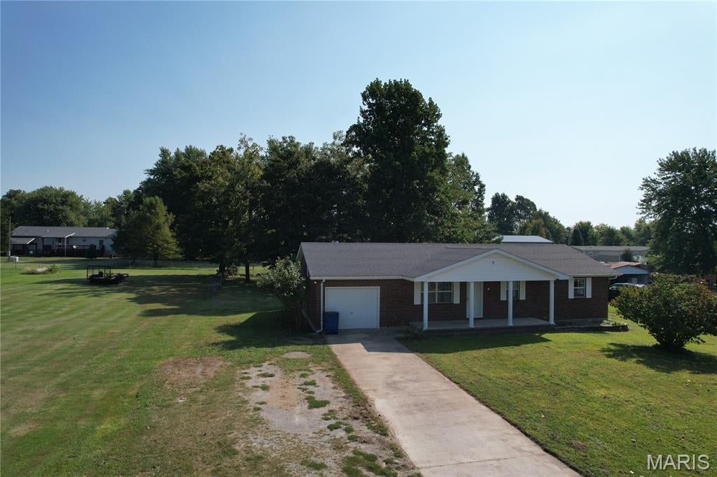 Great Location! Spacious 3-Bedroom, 2-Bath Home with Amazing Bonus Space! This inviting home offers a brick front, central HVAC, and a comfortable open floor plan designed for everyday living and entertaining. The spacious master bedroom features a private master bath, while the home also includes a convenient laundry room and a nicely sized kitchen.

One of the highlights is the large rear addition, featuring windows surrounding the room and a built-in bar. This versatile space can be heated for year-round enjoyment and would make an excellent family room, game room, entertainment area, or gathering space.

Conveniently located close to town, this home combines comfort, functionality, and plenty of space to spread out. Come take a look—you may be surprised by how much this home has to offer!