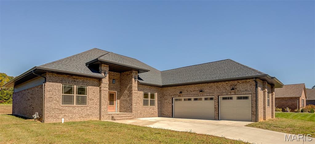 Home is ready for quick occupancy! Welcome to your stunning new construction open concept, one story ranch flawlessly designed for comfort luxury living and timeless elegance. Your home offers 4 bedrooms, 3 baths and 3600 finished livable sq’. The desirable split-bedroom design allows one wing of the home dedicated solely to a primary bedroom suite creating the perfect private retreat with charming seating area.  Its’ luxury+ spa inspired primary bath features a soaker tub, walk-in shower, his & hers vanities and his & hers massive walk-in closets.  A welcoming foyer and impressive great room with soaring vaulted ceiling, a fireplace and tall picturesque windows offers a limitless flow of natural sunlight throughout the home and showcases breathtaking views of the expansive wooded backyard.  Bright gourmet kitchen is the family’s chef dream come true with custom cabinets, quartz countertops, SS appliances, coffee bar, pot filler, center island, breakfast area, fireplace, walk in butler’s pantry and formal dining room. Hosting your next gathering is a breeze with the ultimate lower level boasting a large rec room, family room, wet bar and a media room ready for your own movie theater.  Braeswood Trails Subdivision Provides Amazing Lifestyle w/Walking Trials, Community Park & Lake Access. Minutes to SAFB, Near I-64, easy commute to St Louis, local entertainment, shopping, parks, wineries & O'Fallon's hopping culinary scene. Call, Tour Today & Experience Your Lifestyle Upgrade! Be Part of This Amazing Community!
