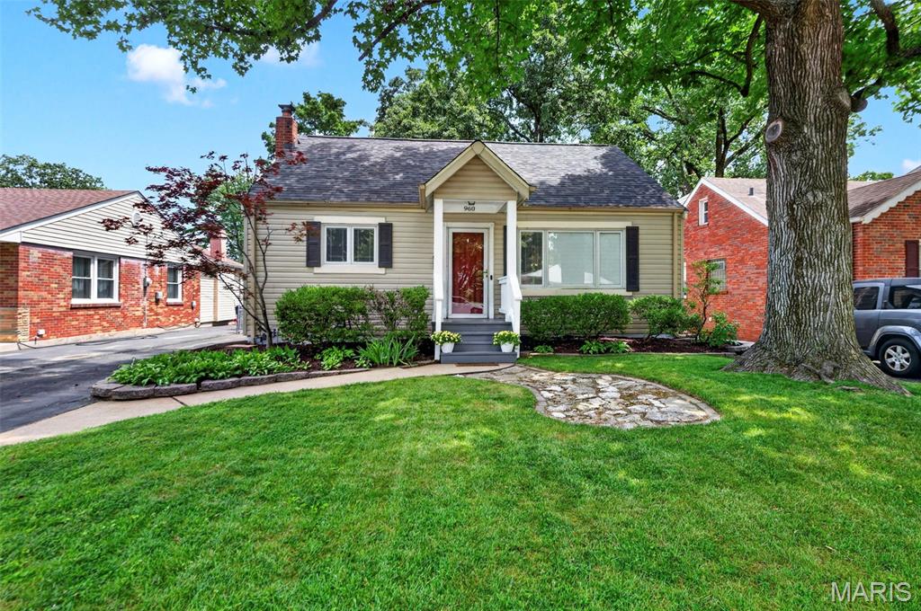 Welcome to this charming home with inviting curb appeal and a welcoming front porch that sets the tone for the warmth found throughout. Step inside to a bright, open floor plan filled with natural light, where beautiful hardwood floors flow throughout the main level. The dining area seamlessly connects to the updated kitchen, showcasing custom white cabinetry, stainless steel appliances, and a timeless subway tile backsplash. Just beyond, a covered porch overlooks the scenic backyard, creating the perfect spot to enjoy your morning coffee or unwind in the evening.

The main level features a comfortable primary bedroom, a second bedroom, and a full bath. Upstairs, you'll find a spacious third bedroom and a versatile bonus room, both accented by luxury vinyl flooring, offering endless possibilities for a home office, playroom, or guest space.

The finished lower level expands the living space with a large family room, a second full bath, and a separate utility room with abundant storage. Outside, the fenced backyard is designed for both relaxation and entertaining, featuring a covered patio that extends to an additional patio area, along with plenty of green space for gardening, pets, and play. A detached one-car garage completes this wonderful property. Ideally located near I-44 with convenient access to shopping, restaurants, and schools, this home offers the perfect blend of comfort, style, and convenience.