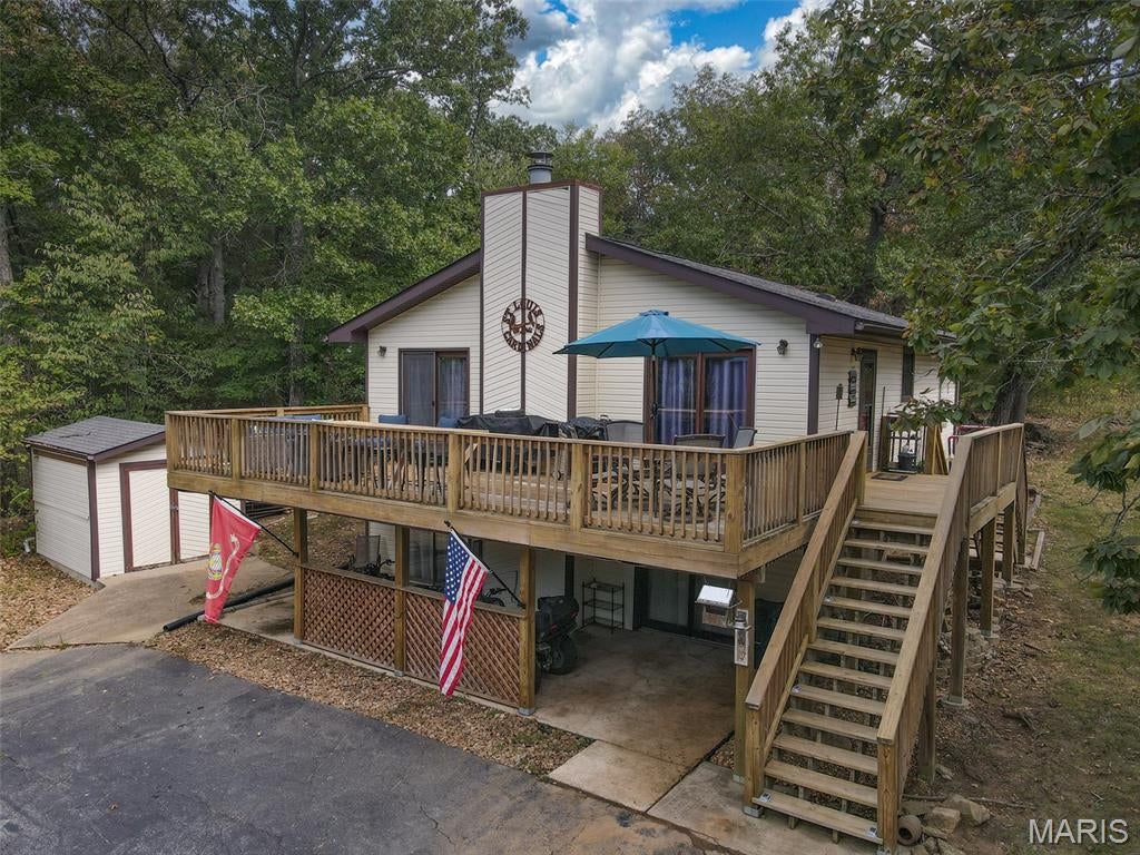 Welcome to your private sanctuary! This charming 3-bedroom, 2-bathroom home sits on an expansive, tree-lined lot of over 1 acre, offering unmatched privacy and peaceful surroundings. Enjoy a short walk to nearby Lac Lafitte for fishing or relaxing by the water. Step out onto a massive back deck, ideal for weekend barbecues, stargazing, or morning coffee surrounded by nature. Updated bathrooms and a new roof installed in 2025. Furniture and two ATVs stay with the house.