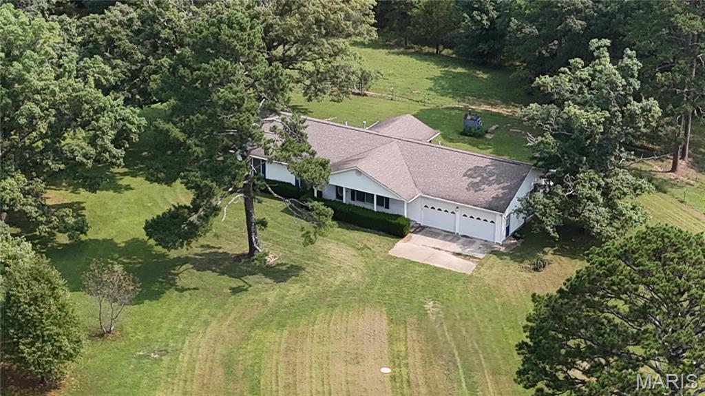 Discover 370 m/l private acres of Ozark beauty featuring mature forest with marketable timber, fenced and crossed fenced pastures currently leased for cattle. With 9 ponds scattered across the landscape, and a mix of woods and open, wildlife never need to leave—making this a premier destination for your own private hunting locale!  You have your choice of 2 homes; The beautifully maintained main residence offers 5 bedrooms, 3.5 baths, a full finished walk-out basement, attached 2-car garage, central heat & air with outdoor wood furnace backup, plus tasteful updates including windows, flooring, kitchen counters, sink, and appliances. A charming second home with 2 bedrooms, 1 bath, sunroom, newer roof, and central heat & air creates endless possibilities for a caretaker, guests, multigenerational living, or an Airbnb. Just 5 miles to Montauk State Park, Missouri’s leading trout park.  Just 15 miles to Salem aka 'Gateway to the Ozark National Scenic Riverways', 7 miles from Flat nasty Off-Road Park, approximately 2.5 hours from St. Louis or Springfield. If 370 acres isn’t enough land to ride on you are about 40 miles to Eminence-the horse trail riding capital of the Ozarks!  This is a rare offering of natural beauty, recreation, and location into one exceptional property.