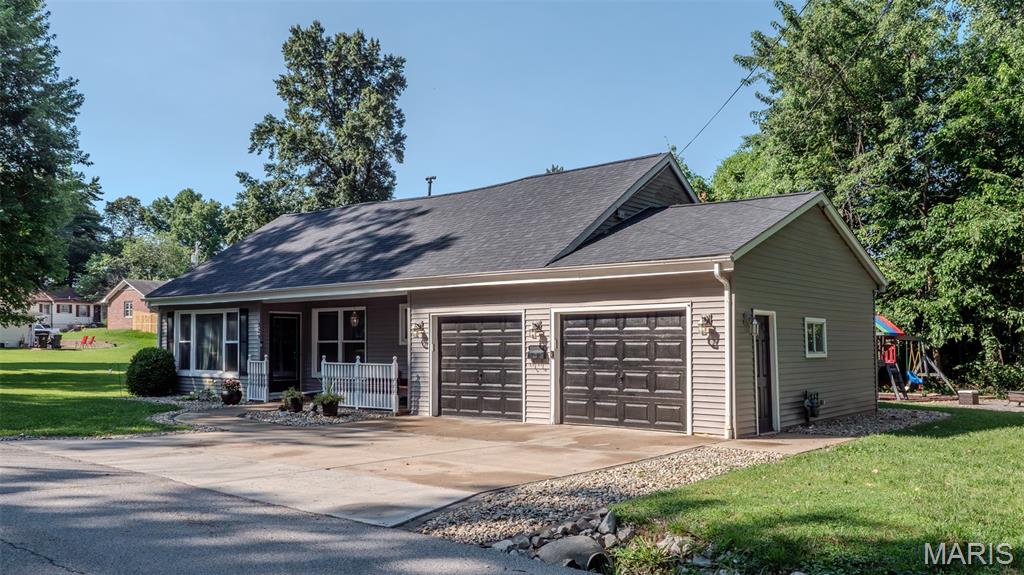 Located in Belleville, Illinois, within St. Clair County, this residential property offers convenient access to urban amenities while maintaining a comfortable suburban setting. Positioned just 25 minutes from St. Louis, this location provides an ideal balance for commuters and those seeking nearby city amenities. 

Situated on a flat lot along a dead-end street, the property offers a quiet environment. Residents will appreciate the proximity to a walking and biking trail, offering immediate recreational opportunities. A two-car garage set up for use as a hobby shop, entertaining purposes, or plenty of space for storage and parking.

The residence spans 1700 square feet and features 4 bedrooms and 2 bathrooms, providing ample living space. An open common space on the upper level is currently being used as the 4th bedroom, but provides an opportunity for a second living room, playroom or studio. An additional room on the upper level currently used as a 5th bedroom could serve as a great office space, walk in closet or storage. 

Recent improvements enhance its appeal, including a new roof installed in 2022 and new flooring installed in 2026 throughout the main level. Further updates contribute to a well-maintained interior. Exterior amenities include a covered front porch, paved driveway, a private back yard patio and deck with canopy, ideal for relaxation and entertaining.