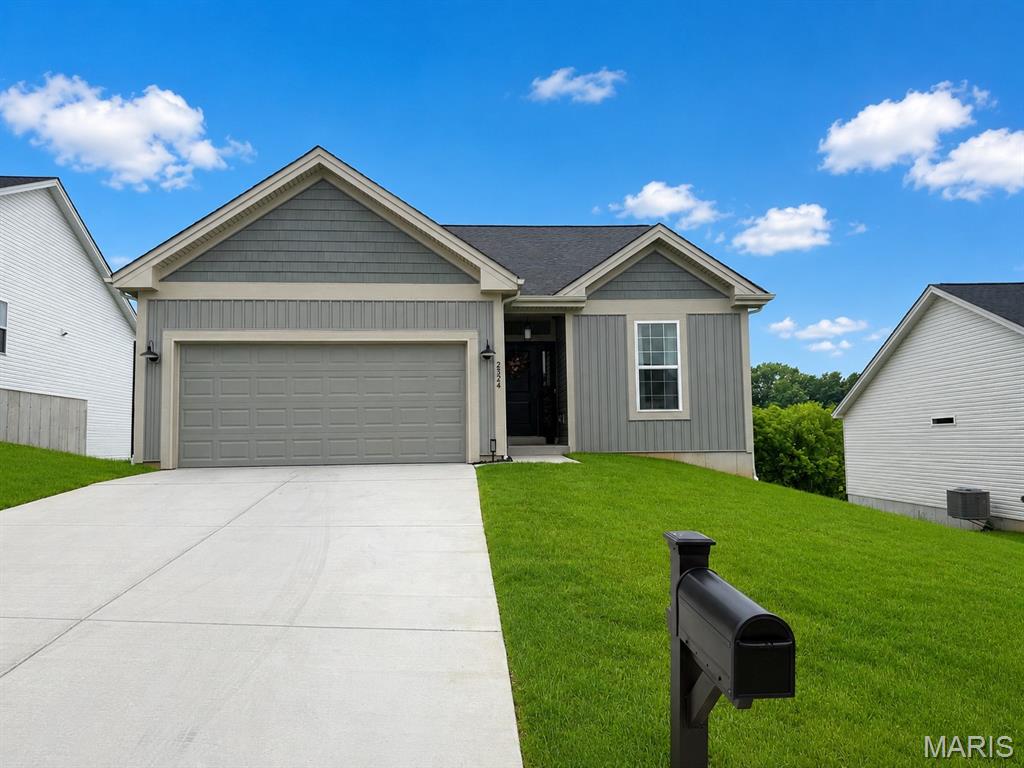 WHY BUILD WHEN THIS BEAUTY IS LIKE NEW! ONLY A YEAR OLD! Stunning ranch-style residence in the sought-after Stonebridge subdivision of Washington, MO! Offering over 1,300 sq. ft. of thoughtfully designed living space, this 2-bedroom, 2-bath home combines modern finishes with everyday comfort.
Step inside to an open-concept floor plan featuring luxury plank vinyl flooring, recessed lighting, and 9-foot ceilings throughout the main level. The beautifully appointed kitchen boasts 42-inch cabinetry, a large pantry, and ample workspace, making it perfect for both daily living and entertaining. The spacious primary suite offers a walk-in closet, a large linen closet, and a private en-suite bath complete with dual sinks and an enclosed glass shower. Convenient main-floor laundry adds to the home’s functionality.
Enjoy peaceful mornings and relaxing evenings on the covered back deck with a ceiling fan, overlooking a serene tree-lined backdrop. The walkout lower level includes a patio, egress window, and endless possibilities for future finishing and additional living space.
Additional features include a 2-car garage and an amazing location with easy access to Highway 100, shopping, dining, and all that Washington has to offer. Don’t miss your opportunity to own this beautiful home in one of Washington’s most desirable communities!