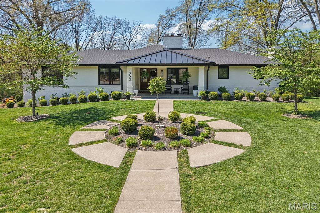 Tucked at the end of a quiet cul-de-sac, this rare ranch-style luxury home offers the perfect blend of modern design, privacy, and turnkey living on a 1.2-acre level lot—an increasingly hard-to-find combination in today’s market. Surrounded by mature trees and thoughtfully designed outdoor living spaces, this property delivers the ultimate private backyard oasis, ideal for entertaining, relaxing, or building your dream pool with a dedicated electric panel already in place.
Extensively renovated and expanded in 2022, this home truly lives like new construction, featuring a new roof, gutters, soffits, fascia, siding, painted brick exterior, and premium Marvin windows and doors. Major systems were also upgraded, including dual HVAC systems, water heater, updated electrical, PEX plumbing, partial sewer lateral replacement, and gas fireplaces, ensuring both efficiency and peace of mind for years to come.
Step inside to discover a stunning open-concept floor plan with engineered wood flooring throughout the main level. The layout flows effortlessly from the den/dining space into a dramatic great room with studio-height ceilings, gas fireplace, and a wall of windows showcasing the picturesque backyard. The adjoining breakfast room is perfectly sized for gatherings both large and intimate.
The gourmet chef’s kitchen is a true showpiece, featuring a Fisher & Paykel refrigerator/freezer, dual-fuel range with gas burners and induction cooktop, four dishwasher drawers, quartz countertops, a striking feature backsplash, pot filler, apron-front sink, and custom Lurk cabinetry. A showstopping walk-in pantry adds both beauty and functionality.
The main-floor primary suite offers a luxurious retreat with dual quartz vanities, a spa-inspired shower, and custom closet systems. Additional bedrooms are thoughtfully designed, with two sharing a well-appointed bath and a private en-suite for the fourth bedroom. Designer touches continue in the powder room and main-floor laundry, both enhanced with custom finishes.
The finished walk-out lower level expands your living space with luxury vinyl flooring, a spacious rec room with bar, mudroom with custom lockers, storage room with a built-in dog washing station, and a fifth bedroom with full bath—ideal for guests or multigenerational living.
Outdoor amenities elevate this home even further with multiple patios, a pavilion with electric, pergola, and greenhouse, creating endless opportunities for entertaining and everyday enjoyment. Additional features include a 27-ft deep oversized 3-car garage with epoxy floors and slat wall storage, permanent holiday lighting, 13 zone lawn irrigation system and an Arlo security system.
This is a rare opportunity to own a fully renovated, move-in ready luxury ranch home that combines modern upgrades, functional design, and exceptional outdoor living—truly like owning a brand-new home in an established setting. See agent remarks for offer deadline update.
