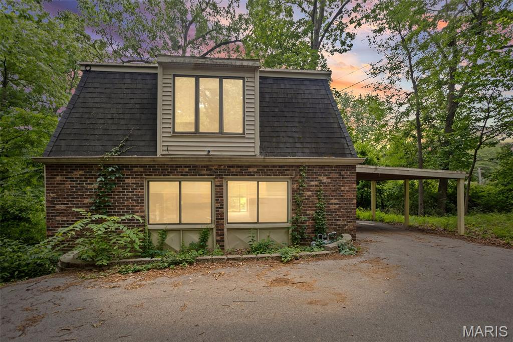 Situated down a long private drive, this Belleville home offers a peaceful, wooded setting on over 1.3 acres. The main level features multiple living areas, a brick fireplace, dining space, kitchen, and bath, while the upper level includes three spacious bedrooms, an additional full bath, and convenient laundry. Enjoy the private backyard views from the deck and the quiet wooded surroundings. Prior updates include Anderson windows and HVAC in 2021. Home is being sold AS IS by a motivated seller. Buyer to verify all MLS information, including square footage, lot size, taxes, schools, and features.