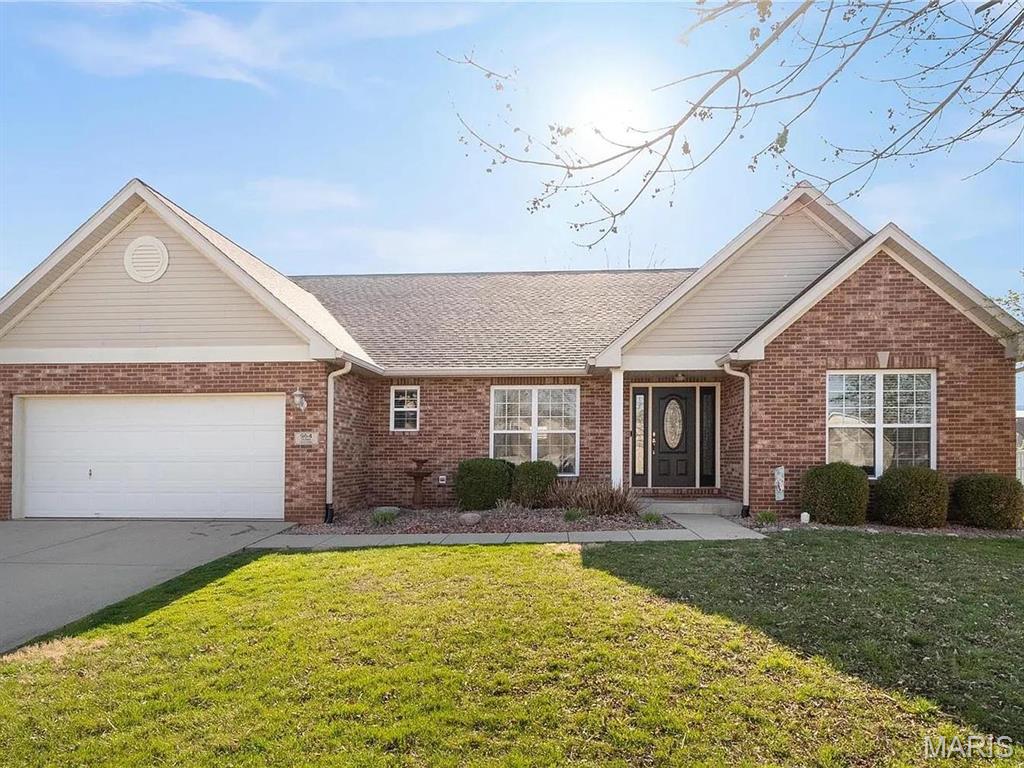 Five Bedroom Home in The Estates at Prairie Crossing Subdivision Features Hardwood Flooring in Main Living Areas, Foyer Entry Opens to Vaulted 19 x 16 Family Room with Oak Surround Glass Fireplace, 23 x 11 Kitchen Features Oak Cabinetry, Ceramic Tile Flooring and Stainless Steel Appliances, Gas Range with Built In Microwave, Dishwasher, Garbage Disposal and Refrigerator, Quartz Counters and Custom Tile Backsplash, Walk In Pantry and Breakfast Bar, Adjacent Dining Area with Back Patio Access, 18 x 17 Dining Room, 13 x 5 Laundry Room, 15 x 12 Master Bedroom with Vaulted Ceiling, Walk In Closet and Private Bath with Jetted Tub, Double Vanity Sinks and Walk In Shower, Full Hallway Bathroom, Two 12 x 10 Bedrooms and 11 x 10 Fourth Bedroom on Main Floor, Full Basement Provides 14 x 13 Fifth Bedroom with Bathroom and Walk In Closet, Unfinished Storage Space, Fenced Back Yard with Fire Pit, Pergola and Patio, Two Car Attached Garage, Solar Panels, Available 08/01/2026.