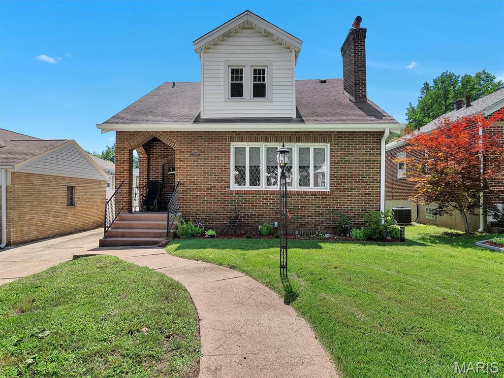 Welcome home to 7448 Hillsdale Drive, a beautifully maintained 3-bedroom, 2 full bath home offering amazing updates, stylish and functional living space. The main level features hardwood floors that were sanded and refinished in 2021, along with an updated kitchen showcasing granite countertops, a farmhouse sink, black stainless steel appliances, ceramic tile flooring, and a new Frigidaire range installed in 2026. The living room offers abundant natural light, a cozy fireplace, and window shades by Bumble Bee Blinds of St. Louis. Recent improvements include a new furnace in June 2024, new gutters and downspouts in 2026, and a new washer and dryer. The second upstairs bathroom was added with new walls, tub/shower, and LVP flooring. The basement has been waterproofed with a transferable warranty so you have no additional worries. Exterior enhancements include landscaping, a shaded flower bed, side lawn, and a shed for extra storage. A transferable 3-year Choice Home Warranty, renewed beginning June 2026, provides additional peace of mind. The property also features a detached 2-car garage and ample off-street parking. Conveniently located near Normandie Golf Club, schools, parks, shopping, dining, and major transportation routes, this well-maintained home offers comfort, thoughtful updates, and lasting value. Information pulled from various sources. Buyer to verify all MLS data.