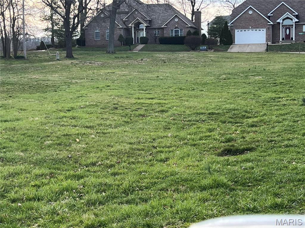Exclusive subdivision adjacent to golf course and lake. Greenbriar Estates.  Lot on cul-du-sac.  Feels like you are miles from town, but actually in the city limits.