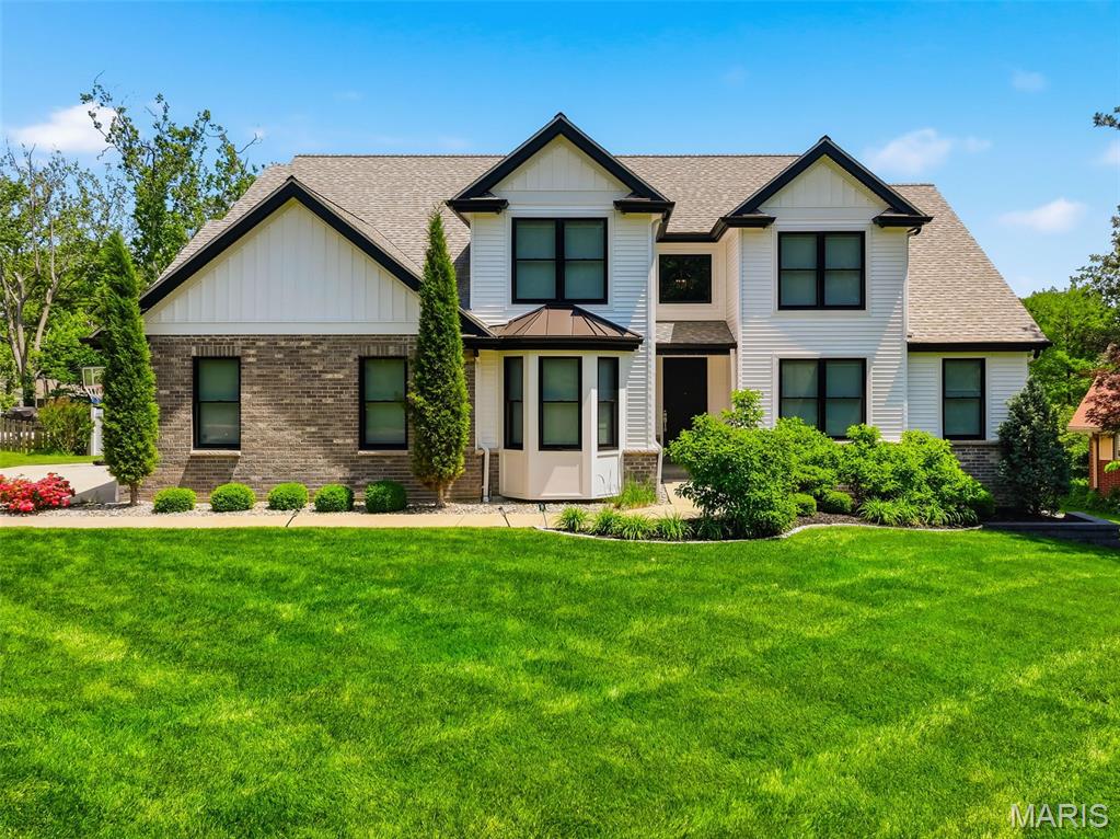 Custom built by Hibbs Homes in 2020, this home combines strong design, high-quality finishes and one of the most impressive outdoor living spaces in the nationally acclaimed Ladue School District. The main level features radiant heated tile flooring throughout the kitchen, living areas, hallways and primary bath. The kitchen comes equipped with custom white cabinetry, high-end granite countertops, a gas range and plenty of room for everyday living and entertaining. An enlarged dining room, (ideal for large family gatherings), private main floor office and custom built-ins add both function and character. The main-floor primary suite includes a spacious walk-in closet and a well-designed bath with heated floors, deep soaking tub and custom shower with a tile feature wall. A double-sided gas fireplace connects the main living area to the screened porch, where automated retractable screens allow the space to open directly to the backyard. Outside, the heated pool and spa include water features, a tanning ledge, automatic safety cover and app-based controls. The custom pergola is equipped with a full outdoor kitchen featuring a built-in gas grill, beverage cooler, sink and bar seating overlooking the pool. The backyard also includes a wood-burning fire pit, gas fireplace, permanent app-controlled holiday lighting, zoned audio, professional landscaping, irrigation, herb garden, storage shed and a fully fenced yard. Upstairs are three bedrooms with one private full bath and one Jack-and-Jill bath. The finished lower level offers additional living and entertaining space with a full bar, bedroom, and full bath, and private home gym. An extended 3 car garage, whole-home audio and generator-ready electrical are the luxury features not seen in every house.
