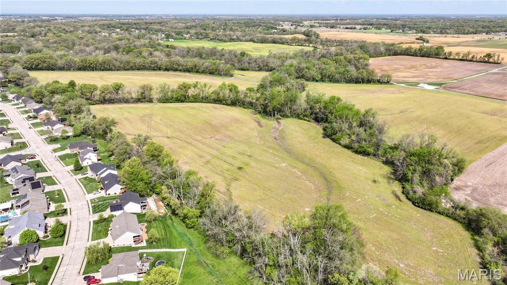 Incredible opportunity to build your dream home—or homes—on this beautiful 48.48-acre property along Lower Marine Road, just minutes outside of Troy, IL. This versatile tract offers a blend of income-producing farmland, mature timber, and gently rolling terrain, providing the perfect balance of natural beauty and practical use. Enjoy the peace and privacy of country living without sacrificing convenience, with easy access to modern amenities and nearby interstates. Whether you're looking for a private estate, a family compound, or an investment opportunity, this land has endless potential.