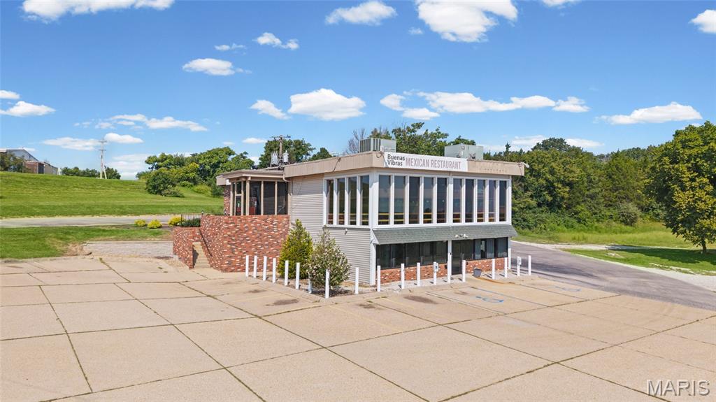 *High-visibility commercial opportunity in St. Clair, MO!* Located on 2.8 acres fronting the N. Outer Rd with excellent I-44 visibility. Two-story, approximately 4,800 SF building with 2,400 SF per level. Upper level is currently leased to a Mexican restaurant. Lower level was previously used as a dispensary and features security glass and a drive-through window.  Flexible layout with multiple potential uses, signage, paved parking for both levels, and excellent exposure as it is located close to the I-44/ Hwy 47 intersection directly behind the newly projected QuikTrip project. Great opportunity for an investor or owner-user!