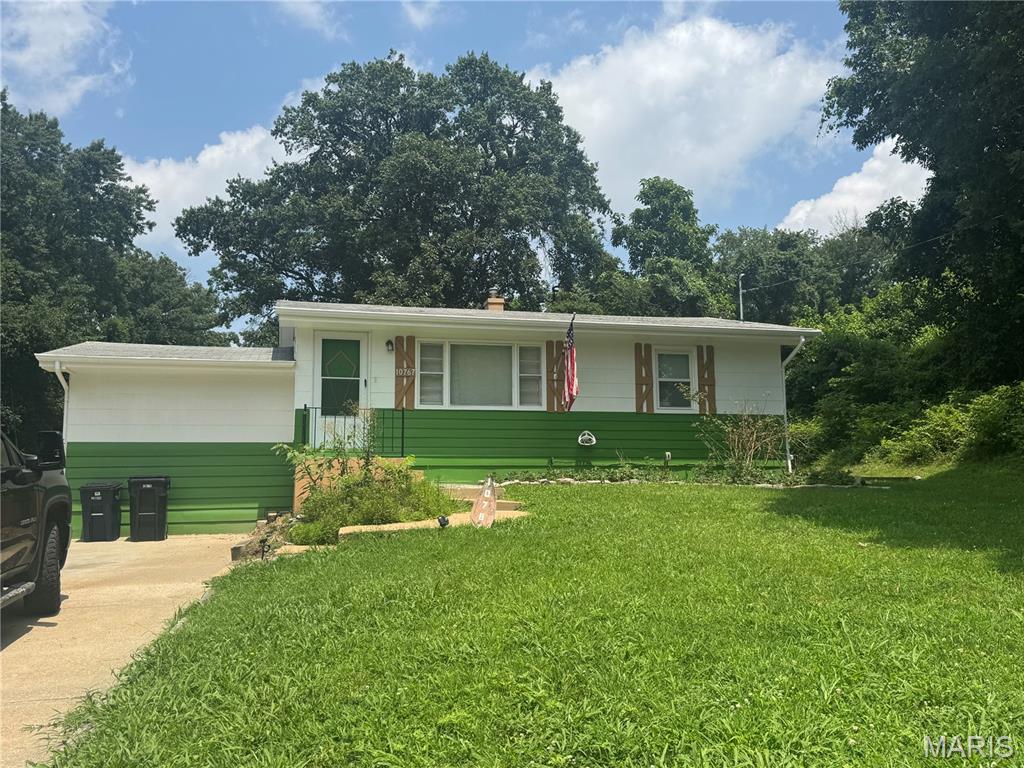 Discover a truly inviting home at 10767 Oak AVE, UNNCRPRT MO 63114, a ready-to-move-in single-family residence built in 1954. This charming ranch-style property offers a seamless blend of classic appeal and comfortable living. The heart of this home is its well-appointed kitchen, featuring a high-end refrigerator that elevates both form and function. Beyond the interior, an expansive patio invites outdoor enjoyment, complemented by a fire pit perfect for gathering under the stars. The property also includes a versatile basement, offering additional space for various needs. This property presents an exceptional opportunity to embrace a lifestyle of ease and enjoyment.