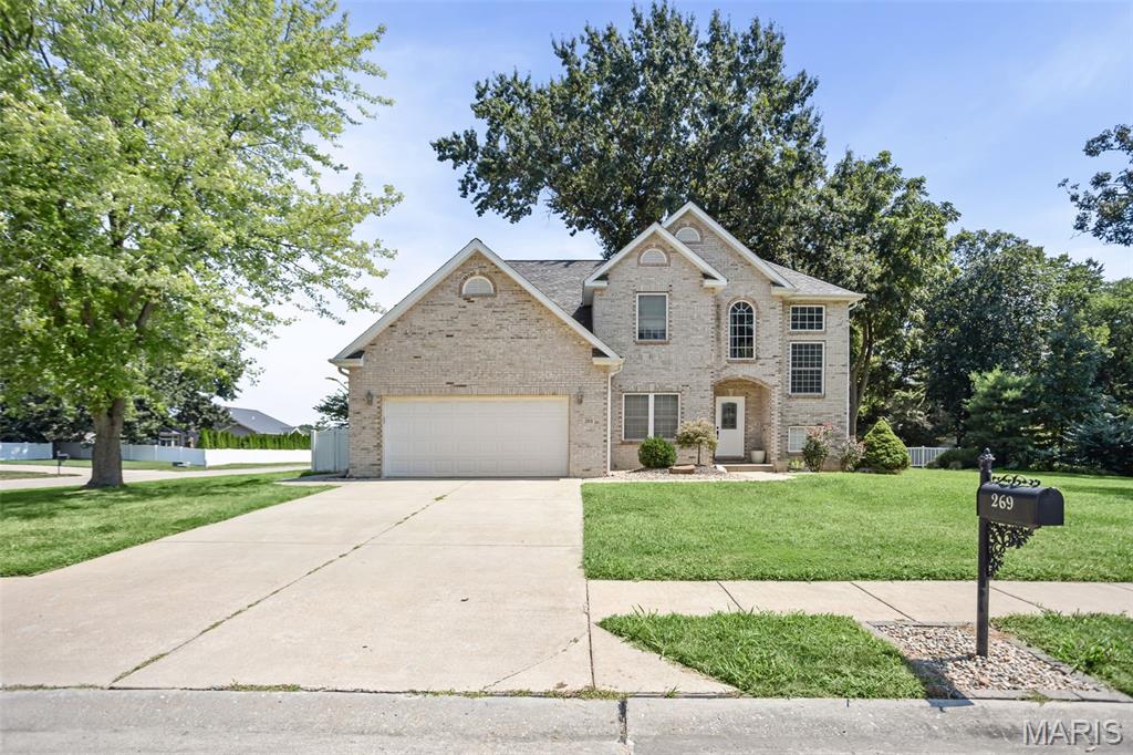 Welcome to this immaculate custom-built home in the highly desirable Northwood subdivision, located within the Triad School District and tucked away on a quiet cul-de-sac. Offering four bedrooms, four baths, and three spacious levels of living, this beautifully maintained home features fresh paint throughout and new flooring on the main level. The impressive entry opens to a stunning great room with soaring 18-foot ceilings, elegant columns, and a beautiful staircase leading to the upper-level loft and nook. The eat-in kitchen offers maple cabinetry, a center island, and convenient main-floor laundry and bedroom 1 on main floor. Upstairs, you’ll find three additional bedrooms and two full baths, including a spacious primary suite with a walk-in closet and dual vanities. The finished lower level boasts 9-foot ceilings, a full bathroom, generous entertaining space, and abundant storage. Outside, enjoy a nicely sized backyard with plenty of room for entertaining, relaxing, and making memories. This exceptional home offers the space, style, and location you’ve been looking for!