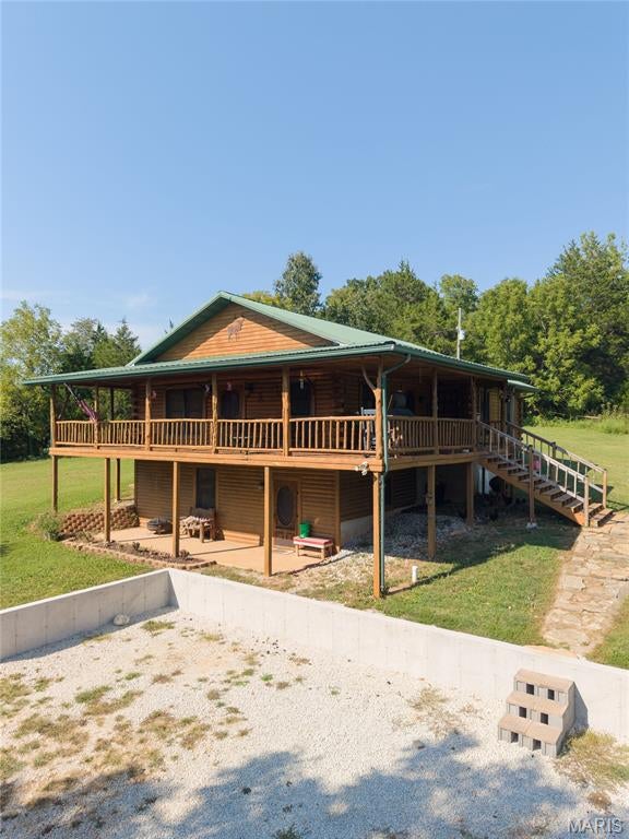 Located just above the Little Shoal Creek, this charming two-story log cabin home offers approximately 2,400 square feet with 3 bedrooms, 1 bonus room (currently being utilized as a 4th bedroom), and 3 bathrooms. The spacious wraparound porch is the perfect place to relax, enjoy peaceful evenings, and take in the star-filled skies.

Inside, you’ll find beautiful maple-finished cabinets, warm wood accents throughout, and hardwood floors that give the home a welcoming cabin feel. A unique spiral staircase connects the levels, adding great character. The durable metal roof provides long-lasting protection.

The property sits on 3.98 acres 2 of which are open land. Outside amenities include a circle driveway, a spacious pole barn with plenty of room for storage, equipment, parking/garage use, or outdoor toys. A sturdy retaining wall was added in 2025 to add spacious parking along with a 30x30 concrete pad used for a basketball court. Not to mention the chicken coop that was recently added to this beautiful home. 

Located minutes from Missouri’s floating capital, this property provides convenient access to the Huzzah, Courtois, and Meramec Rivers, making it an ideal spot. Also we can’t forget that Mark Twain National Forest is surrounding the area! You will have many opportunities for ATV riding, hunting, hiking, and exploring the beautiful outdoors.

PRICED TO SELL