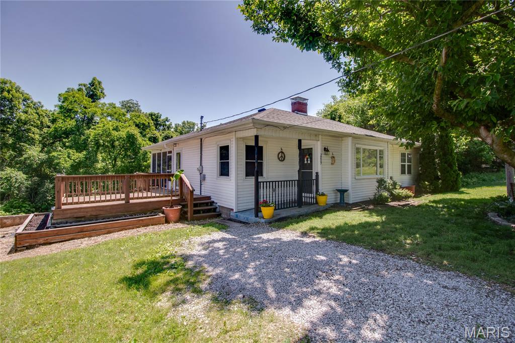 THIS IS A MUST SEE!! This 3-bedroom, 2-bath home has tons to offer! Conveniently located in the heart of  this home features fresh paint throughout, brand-new carpet, and several major updates already completed, including a furnace and A/C replaced in 2012 and a roof that is approximately 10 years old.
The spacious living room features a wood-burning fireplace.(Gas line is in place in basement to convert the fireplace to gas if desired. The seller also has a new gas log they are willing to leave!) The kitchen comes complete with appliances that will stay with the home. The real showstopper is the outdoor living space. Step outside to a large deck and an impressive screened-in porch with vaulted ceilings—perfect for entertaining, relaxing, or simply enjoying views of the large backyard. 
The walkout basement offers a laundry area along with plenty of opportunity to add additional finished living space to suit your needs. Affordable living! This home is in a price point that is hard to beat!