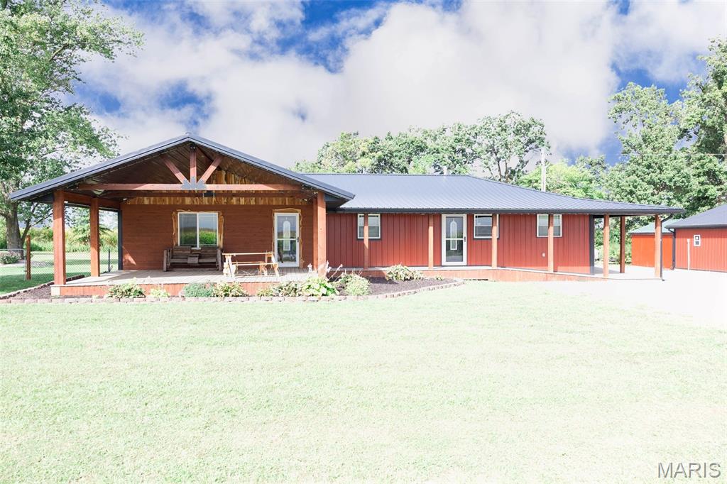 This beautifully renovated home offers modern comfort with country charm, all less then 15 minutes away from Mark Twain Lake. Featuring durable steel siding and roof, this 3-bedroom, 2-bath residence has been thoughtfully updated with high-efficiency upgrades throughout.

Inside, you'll find custom soft-close cabinetry, quartz countertops, and stunning custom cedar accents that add warmth and character to every room. The spacious layout is perfect for everyday living, and a covered front porch makes the perfect spot to relax and take in the views.

Outdoors, enjoy your own above-ground pool and two impressive shops offering over 2,200 sq. ft. and 290 sq. ft. of space. One shop is equipped with four 10x10 garage doors and 6" concrete floors, making it ideal for storage, projects, or hobbies of all kinds. The property also includes a hard-wired security system for peace of mind.

Located just outside of Center, MO, this property provides a rare combination of modern finishes, functional space, and country living.