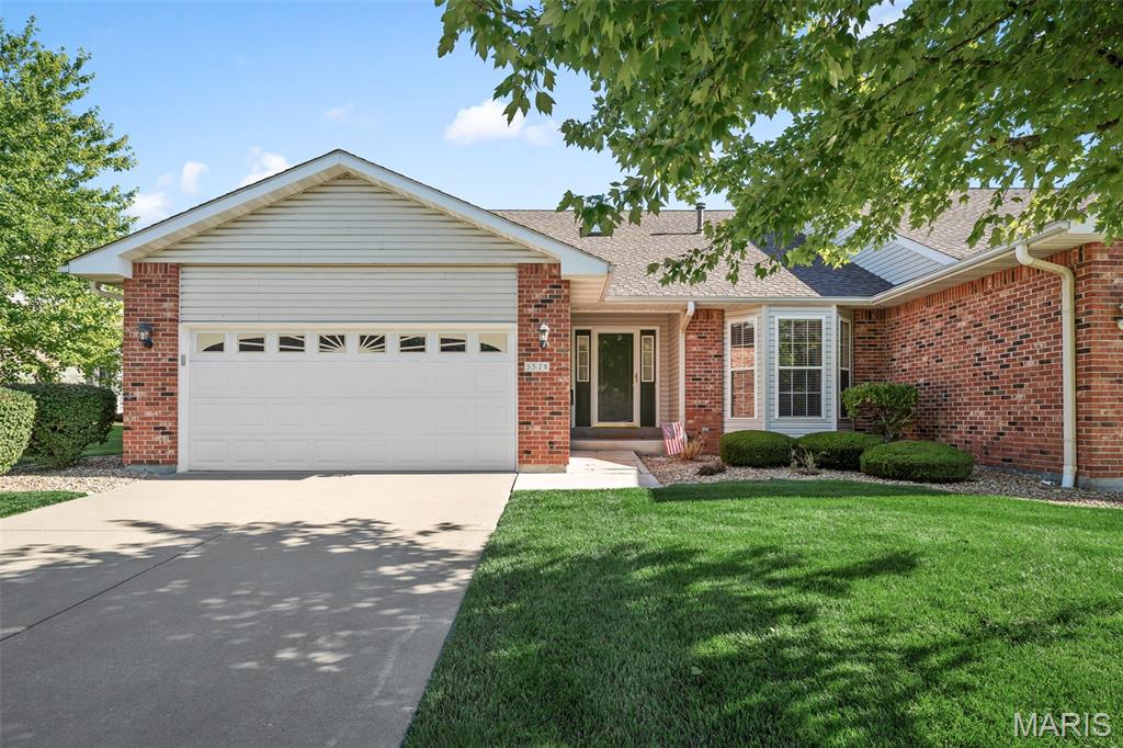 Enjoy low-maintenance living in this well cared for 3-bedroom, 3-bathroom St. Charles End-Unit Villa! A foyer with hardwood floors and a skylight offers a welcoming entry, while bay windows throughout the home contribute to its light-filled interior. The kitchen is appointed with hardwood floors, ample cabinetry space, and easy access to the 11x10 screened in composite deck- the perfect place to enjoy your morning coffee. The spacious great room is highlighted by vaulted ceilings and a cozy gas fireplace. Retreat to the primary bedroom complete with an 8x6 walk-in closet and an en-suite bath featuring a double vanity. Enjoy the convenience of the main floor laundry room leading to the two-car drywalled garage! The finished lower level expands your living space with a generous recreation area, third bedroom w/ a walk in closet, third full bathroom, and a dry bar with countertop and cabinetry space. Washer, Dryer, and Refrigerator are included. Seller is offering a $5,000 credit towards carpet replacement!